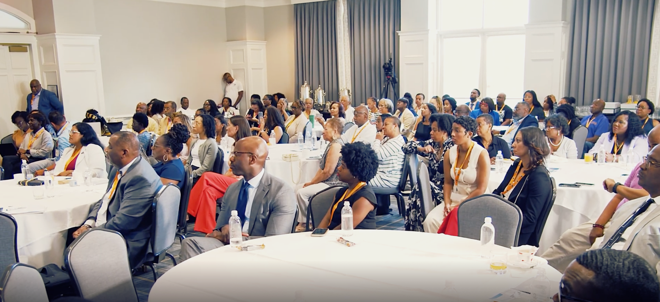 Attendees seated at round tables during an NCABL event